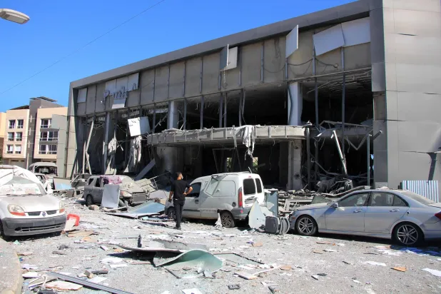 A man inspects the aftermath at the site of an Israeli strike that hit the previous day in the southern Lebanese coastal city of Tyre on June 5, 2026. (Photo by Kawnat HAJU / AFP)