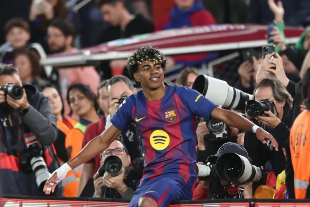 Barcelona's Spanish forward #10 Lamine Yamal celebrates scoring his team's third goal during the Spanish league football match between FC Barcelona and RCD Espanyol at the Camp Nou stadium in Barcelona on April 11 , 2026. (Photo by Josep LAGO / AFP)