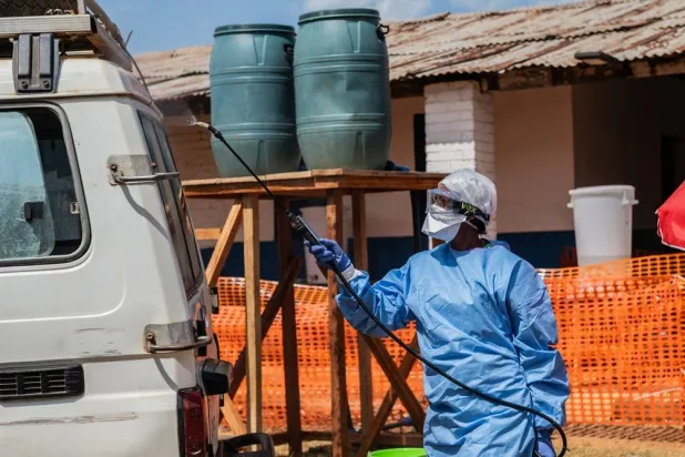 A health worker disinfects an ambulance at the Mongbwalu treatment center that transported a suspected Ebola patient in Mongbwalu, Congo, Friday, June 5, 2026. (AP) 