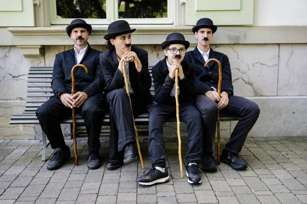 Some of the 429 people dressed as "The Tramp" pose for a photo during the 10th anniversary of Chaplin's World, the museum dedicated to the life of Charlie Chaplin, in Corsier-sur-Vevey, Switzerland, 07 June 2026. (EPA)