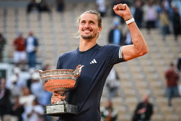 07 June 2026, France, Paris: German tennis player Alexander Zverev celebrates his victory with the trophy after defeating Italy's Flavio Cobolli during their Men's Singles Final match of the French Open tennis tournament on Court Philippe-Chatrier at the Roland-Garros complex. Photo: Matthieu Mirville/ZUMA Press Wire/dpa