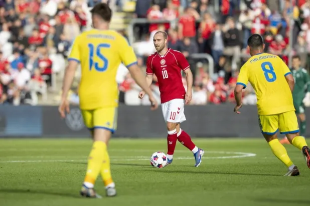 Denmark's Christian Eriksen between Ukraine's Tsygankov (L) and Ruslan Malinovskyi during the international soccer friendly match Denmark against Ukraine at Odense Stadium, in Odense, Denmark, 07 June 2026. (EPA)