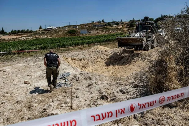  An Israeli security personnel inspects an impact site, after Iran launched missiles towards Israel, in an Israeli settlement in the Israeli-occupied West Bank, June 8, 2026. (Reuters)