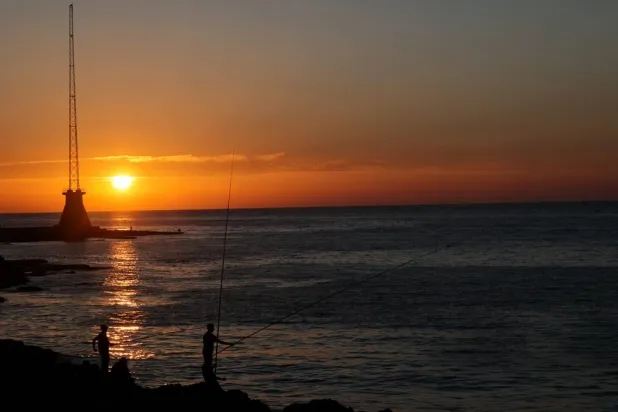 People fish at sunset near the Corniche Al-Manara seafront promenade on the Mediterranean coast in Beirut, Lebanon, 05 June 2026. (EPA)