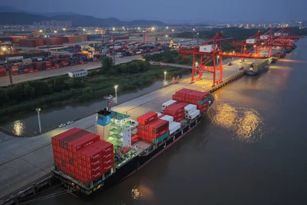 Containers and ships are seen at the port in Nanjing, in China's eastern Jingsu province early on June 9, 2026. (AFP)