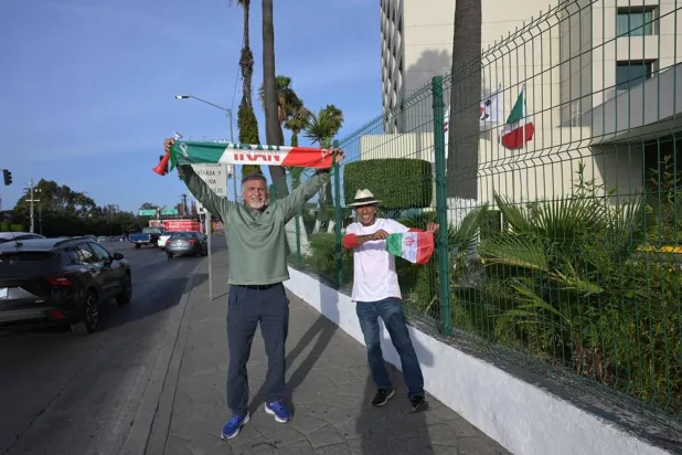  Reza Mansoori (R) and Mostafa Pourmanda, Iranian supporters living in San Diego and staying at the same hotel as Iran's national football team, cheer for their team in Tijuana, Mexico, on June 8, 2026, ahead of the FIFA 2026 World Cup football tournament. (AFP) 