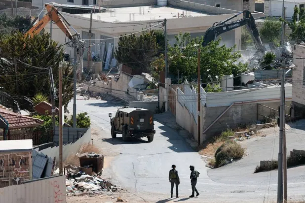  Israeli military excavators demolish a Palestinian building in the town of Jabaa in the Israeli-occupied West Bank, near Jerusalem June 3, 2026. (Reuters)