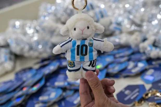 In this photo taken on June 5, 2026, a worker packs merchandise of Lionel Messi of Argentina's national football team, which will participate in the FIFA World Cup 2026, at the All Star Partner factory in Yiwu in eastern China's Zhejiang province.(AFP)