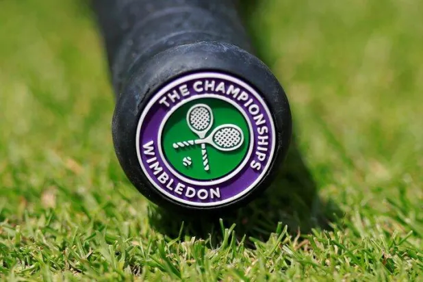 Tennis - Wimbledon - All England Lawn Tennis and Croquet Club, London, Britain - July 2, 2019 General view of the Wimbledon logo on the base of the handle of a tennis racquet REUTERS/Andrew Couldridge/File Photo