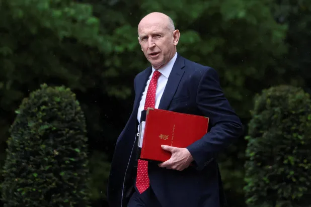 FILE PHOTO: Britain's Defense Secretary John Healey walks outside 10 Downing Street, on the day of a cabinet meeting, in London, Britain, June 2, 2026. REUTERS/Toby Melville/File Photo
