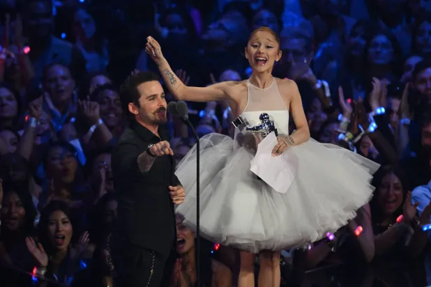 US singer-songwriter Ariana Grande (R) and US music video director Christian Breslauer accept the award for Video of the Year for "Brighter Days Ahead" on stage during the MTV Video Music Awards at UBS Arena in Elmont, New York, on September 7, 2025. (Photo by ANGELA WEISS / AFP)
