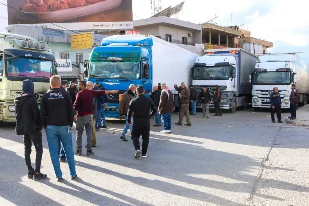Lebanese trucks transporting goods wait at the Masnaa border crossing with Syria. AFP file photo