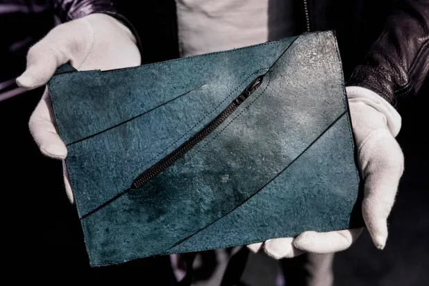 This photograph shows the first "T-Rex leather" bag on display ahead of its auction at the Hotel Drouot auction venue in Paris on June 9, 2026. (Photo by STEPHANE DE SAKUTIN / AFP)