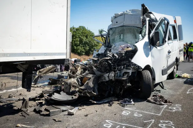 A damaged minibus is seen on the M1 motorway near Gyor, Hungary, 12 June 2026. EPA/Csaba Krizsan HUNGARY OUT