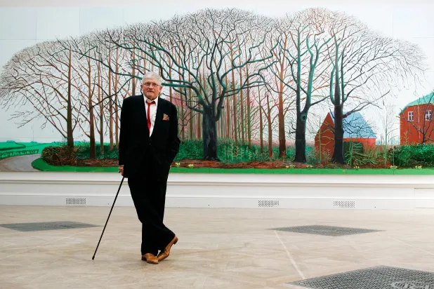 British artist David Hockney poses as he unveils his painting "Bigger Trees Near Water", the largest painting ever shown at the Royal Academy's Summer Exhibition, London, Friday, May 25, 2007. (AP)