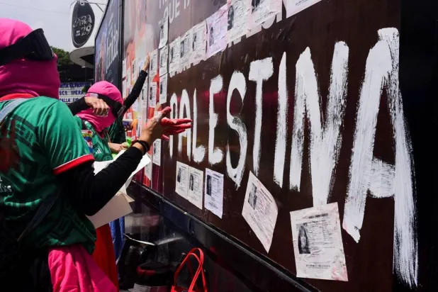  Demonstrators place missing person flyers on the trailer of a mounted police truck during a protest outside Azteca Stadium ahead of the opening match of the 2026 FIFA World Cup in Mexico City, Mexico, June 11, 2026. (Reuters)