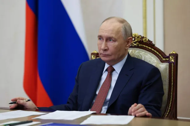 In this pool photograph distributed by Russian state agency Sputnik, Russia's President Vladimir Putin attends a video meeting in Moscow on June 13, 2026, amid the ongoing Russian-Ukrainian conflict.  (Photo by VYACHESLAV PROKOFYEV / POOL / AFP)