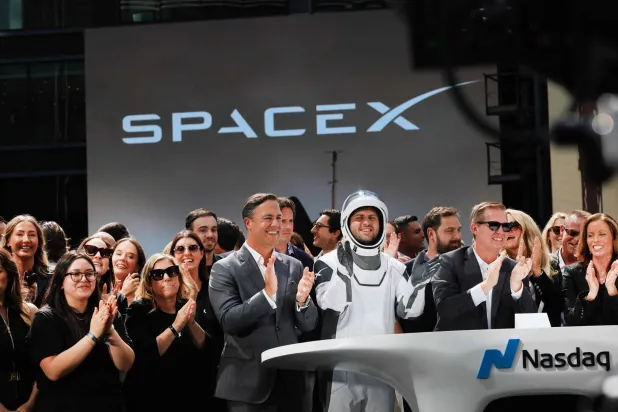 SpaceX employees celebrate the close of the company’s initial public offering on the Nasdaq Stock Market in New York City. (Getty Images/AFP)