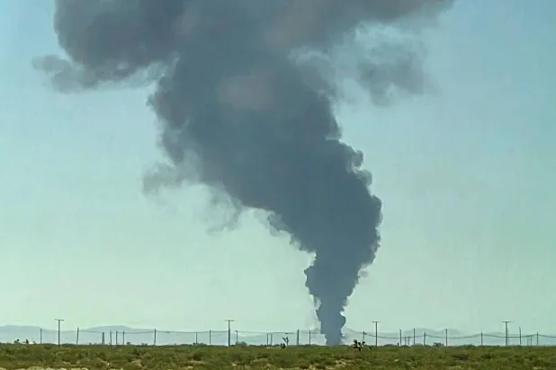 Smoke plumes rise from a B-52 bomber that crashed shortly after takeoff at a US Air Force base in Southern California, Monday, June 15, 2026. (Debbie Reyes Katz via AP Photo)