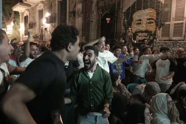  Fans celebrate after Egypt scored the first goal as they watch a broadcast of the World Cup match between Egypt and Belgium at a coffee shop in Cairo, Egypt, Monday, June 15, 2026. (AP)