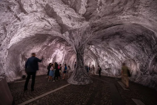  Visitors walk into the artwork "The Pont Neuf Cave" by French street artist JR on the Pont Neuf bridge, Tuesday, June 16, 2026, in Paris, open to the public from June 15 to 28. (AP)