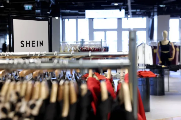 This photograph shows a view of the Asian e-commerce giant Shein store at the Bazar de l'Hotel de Ville (BHV) department store in Paris on March 19, 2026. (AFP)