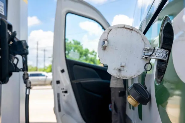 A person prepares to pump gas at a Valero gas station on June 16, 2026 in Austin, Texas. (Getty Images via AFP) 