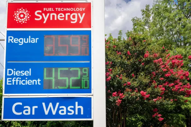 AUSTIN, TEXAS - JUNE 16: Gas prices are displayed at an Exxon Mobil gas station on June 16, 2026 in Austin, Texas. Brandon Bell/Getty Images/AFP