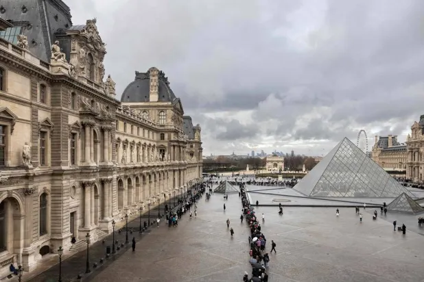 This photograph shows visitors, seen from the Sully wing, queuing in the Cour Napoleon by the pyramid designed by Chinese-US architect Ieoh Ming Pei, to enter the Louvre Museum in Paris on November 19, 2025. (AFP)