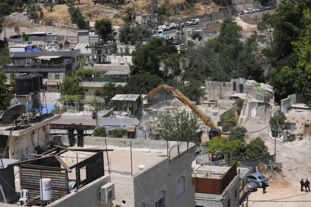 هدمت السلطات الإسرائيلية منزلاً فلسطينياً في حي سلوان بالقدس الشرقية مايو الماضي (أ.ب)