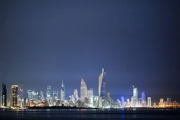 This photograph shows the conjunction of Jupiter and Venus over the skyline of Kuwait City on June 9, 2026. (Photo by YASSER AL-ZAYYAT / AFP)