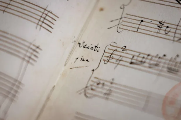 This photograph taken on June 15, 2026, shows an original fragment of Wolfgang Amadeus Mozart's music handwritten notebook at Richelieu Library (Bibliotheque Nationale de France-National Library of France-BnF) in Paris. (Photo by Kenzo TRIBOUILLARD / AFP)