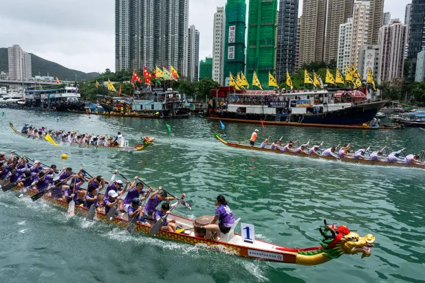 Competitors take part in the Aberdeen Dragon Boat Race to celebrate the Dragon Boat Festival in Hong Kong, Friday, June 19, 2026. (AP Photo/Chan Long Hei)