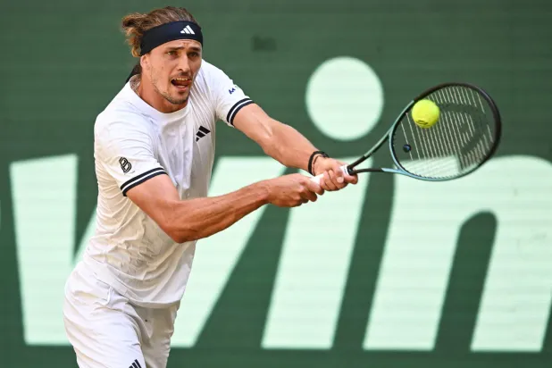 Germany's Alexander Zverev returns the ball to Taylor Fritz of the US during their men's singles semi-final match of the Halle Open ATP tennis tournament in Halle, western Germany, on June 20, 2026. (Photo by CARMEN JASPERSEN / AFP)