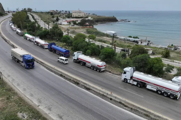 A drone view shows oil trucks arriving from Iraq on their way to the Baniyas oil terminal, Syria, May 14, 2026.  (Reuters)