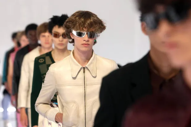 Models present creations by Italian fashion house Prada for the Men's Spring/Summer 2027 collection during the Milan Fashion Week in Milan, Italy, 21 June 2026. Milan Fashion Week runs from 19 to 23 June 2026. (EPA)