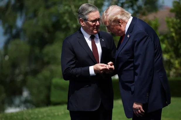 Trump and Starmer on the sidelines of the G7 summit in Evian, eastern France, on June 16 (AFP)