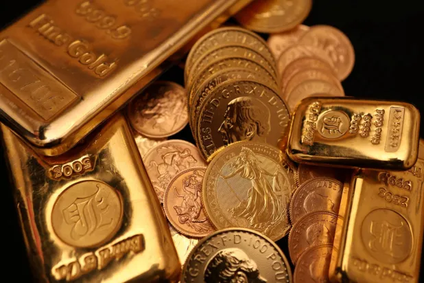 Gold Slips Over 2% as Dollar Holds Firm on Fed Rate-hike Expectations