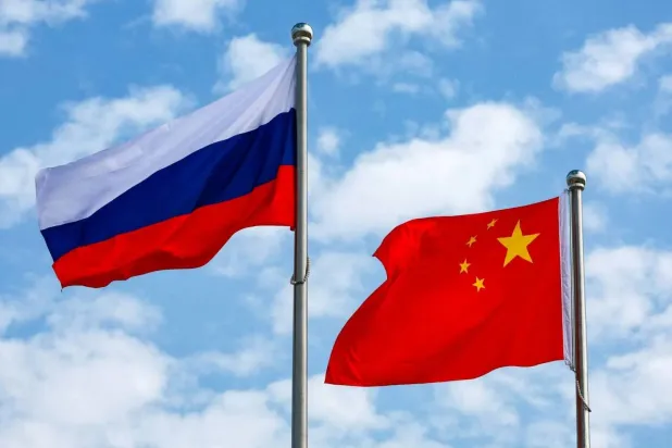 Chinese and Russian flags fly at an airport in Tianjin, China August 31, 2025. Sputnik/Vladimir Smirnov/Pool via REUTERS 