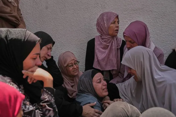 Mourners grieve for Palestinian woman Shahd Ashour, who was killed in an Israeli airstrike on Monday in Gaza City (AP). 