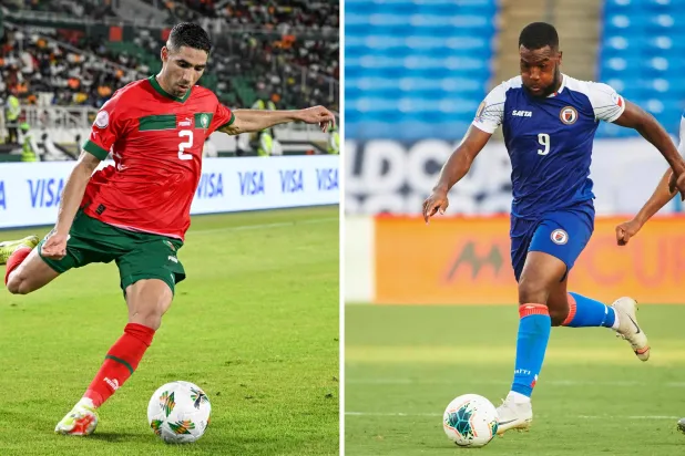 مدافع منتخب المغرب أشرف حكيمي (يسار) ومهاجم منتخب هايتي دوكنز نازون (أ.ف.ب)