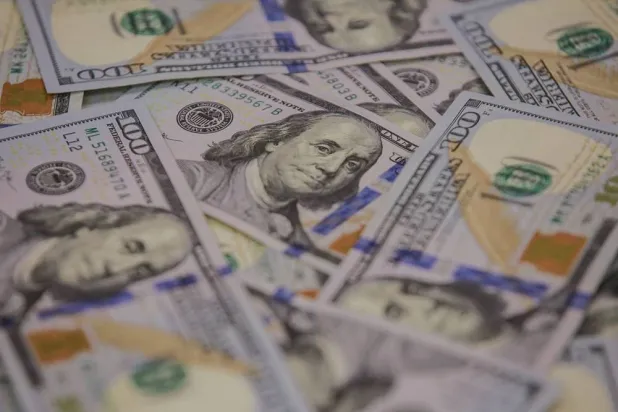  14 January 2020, Iraq, Baghdad: US dollar banknotes are pictured at a currency exchange service provider. (dpa)