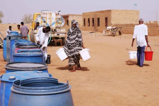 People fill water containers at a free distribution point amid water outages in Khartoum, Sudan, May 18, 2026. (AP)