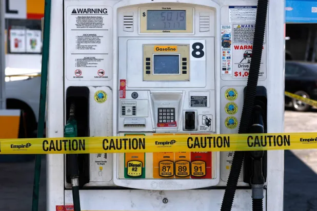 LOS ANGELES, CALIFORNIA - JUNE 22: Yellow caution tape is seen wrapped around a gas pump at a Shell gas station on June 22, 2026 in Los Angeles, California. Justin Sullivan/Getty Images/AFP 