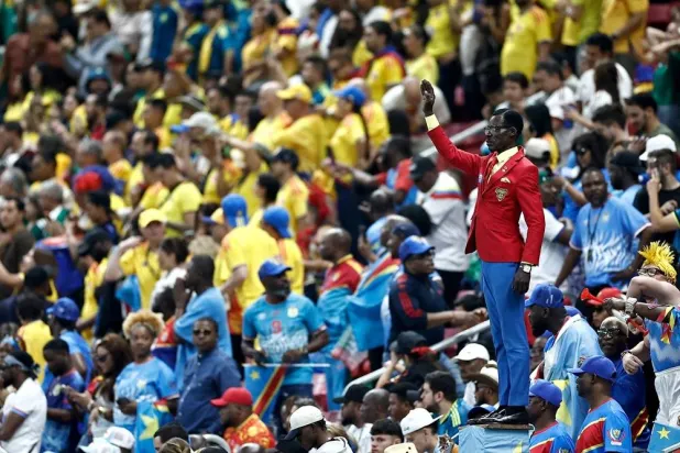 Democratic Republic of Congo's supporter Michel Kuka Mboladinga, pays tribute to Democratic Republic of Congo's late prime minister Patrice Lumumba, by remaining motionless ahead of the 2026 World Cup Group K football match between Colombia and Democratic Republic of Congo at the Guadalajara Stadium in Zapopan on June 23, 2026. (AFP) 
