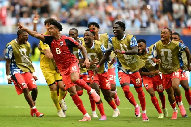 Cape Verde's midfielder #06 Kevin Pina celebrates with teammates after scoring his team's first goal during the 2026 World Cup Group H football match between Uruguay and Cape Verde at the Miami Stadium in Miami Gardens on June 21, 2026. (AFP)