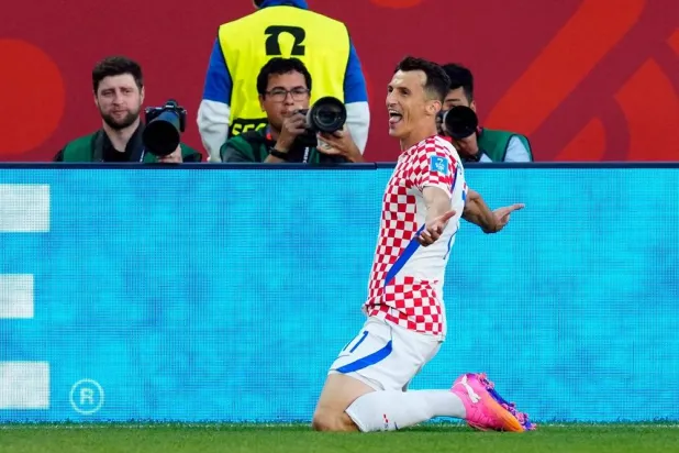  Croatia's Ante Budimir (11) celebrates a goal against Panama during the second half of a World Cup Group L soccer match, in Toronto, on Tuesday, June 23, 2026. (Frank Gunn/The Canadian Press via AP) 