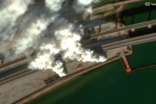 A satellite image shows smoke rising by the Crimea Bridge, amid the Russia-Ukraine conflict, Crimea, June 22, 2026.(Vantor/Handout via Reuters)