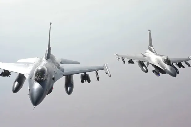 A still from a video released by US Central Command on Friday showing US Air Force F-16 fighter jets refueling mid-air during a patrol mission over the Middle East (CENTCOM)