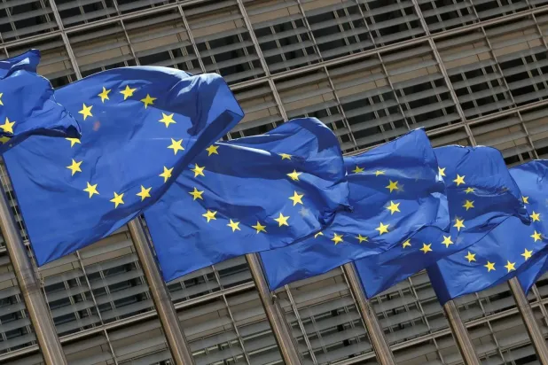 European Union flags flutter outside the EU Commission headquarters in Brussels, Belgium May 5, 2021. REUTERS/Yves Herman/File Photo
